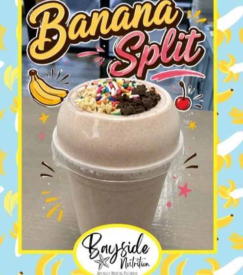 Banana Split protein shake topped with rainbow sprinkles, cookie crumble and nuts
