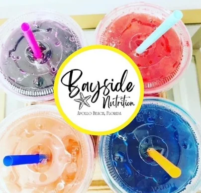 Four loaded teas from above — purple, red, peach and blue — with colored straws