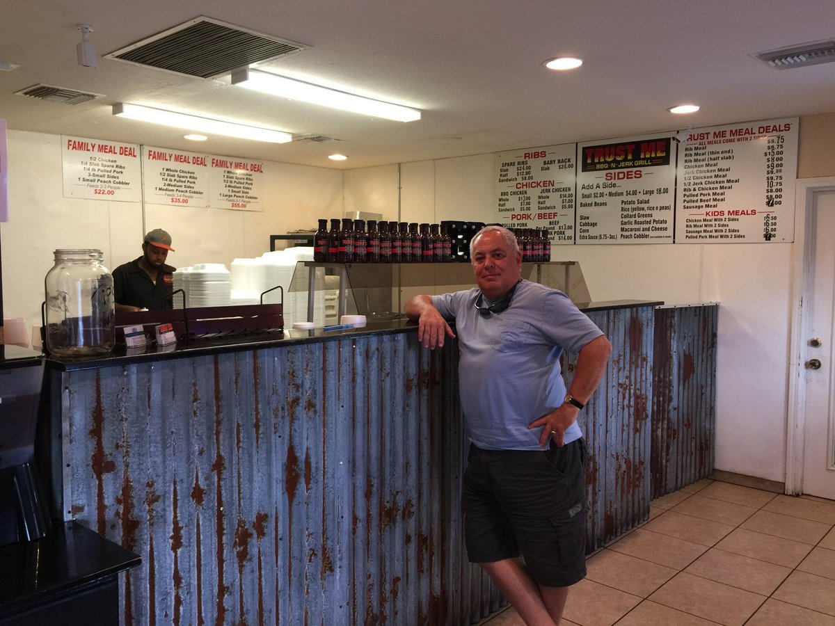 Behind the counter with menu boards
